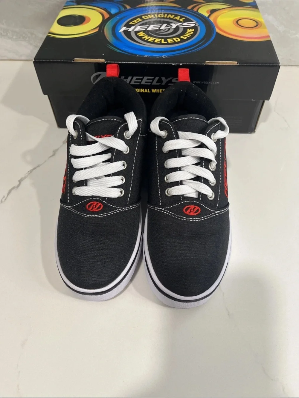 Heelys Black Canvas Sneakers with Red Accents and White Soles